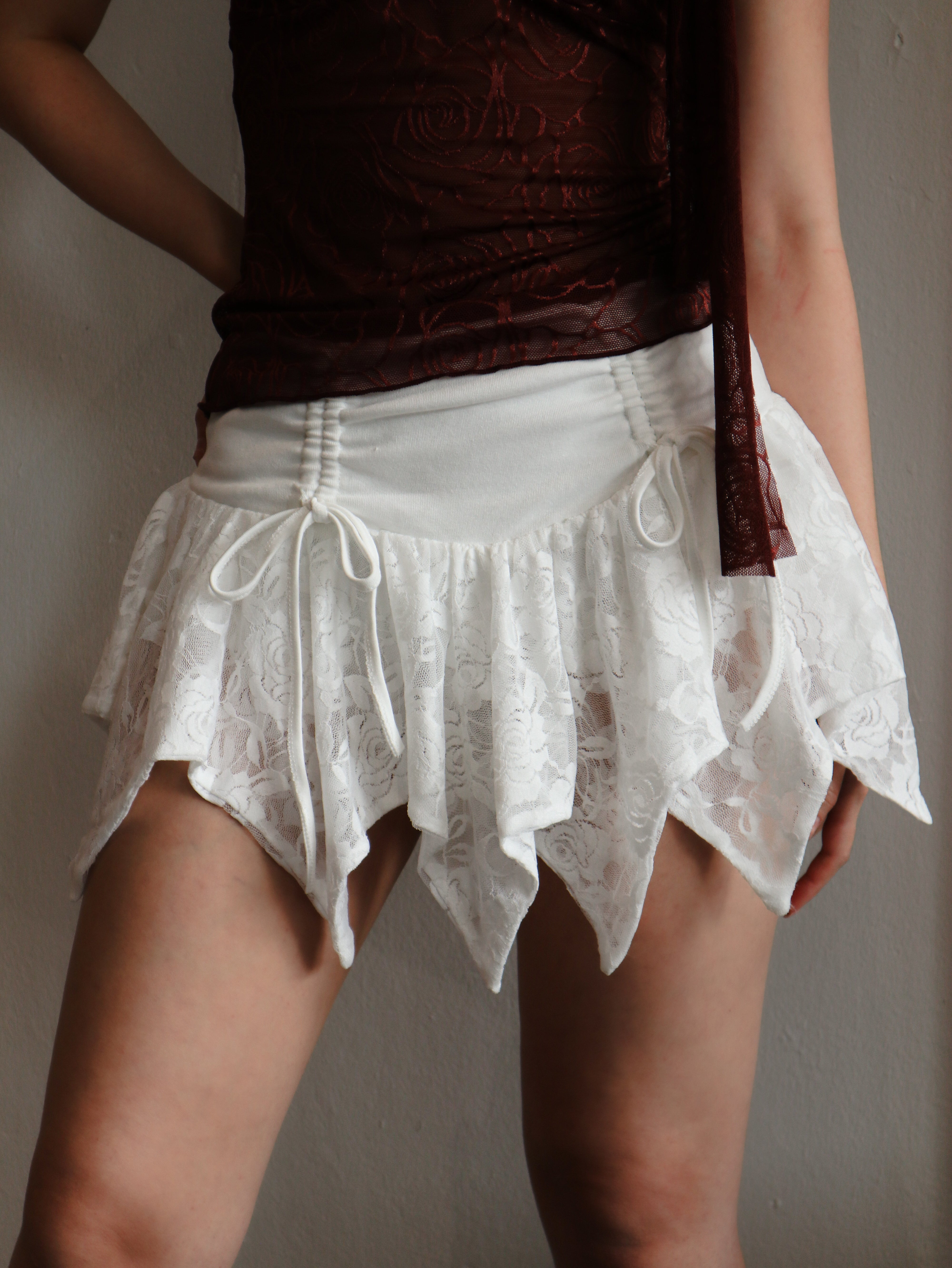 White Lace Asymmetrical Hem Mini Skirt